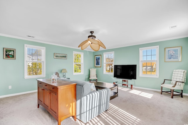 living room featuring light carpet, baseboards, and a wealth of natural light