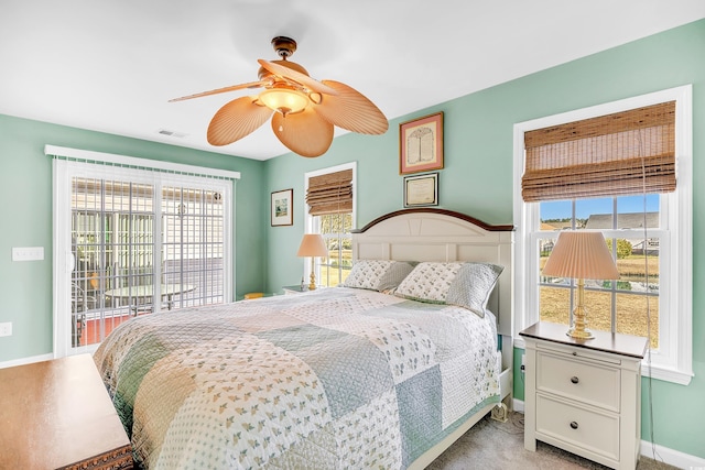 bedroom featuring baseboards, visible vents, access to outside, and a ceiling fan