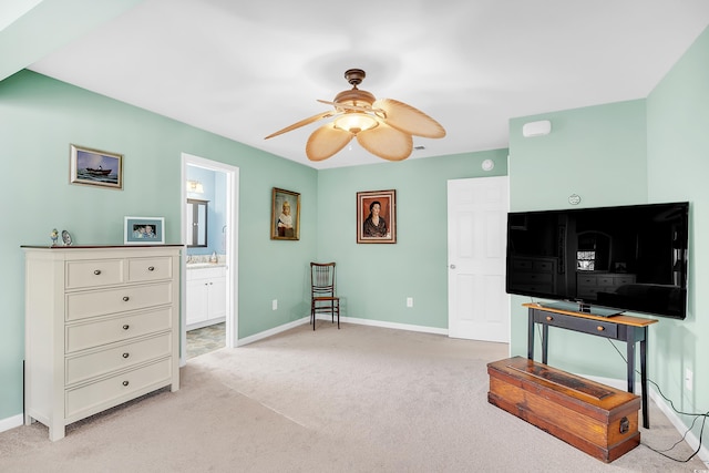 sitting room featuring light carpet, ceiling fan, and baseboards