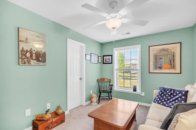 sitting room with carpet, visible vents, ceiling fan, and baseboards