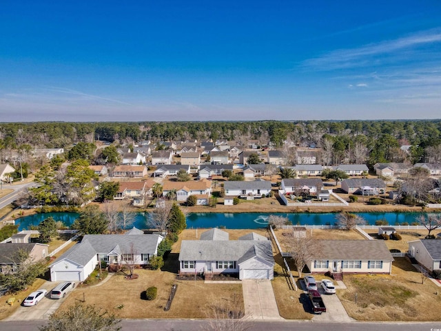 aerial view with a water view and a residential view