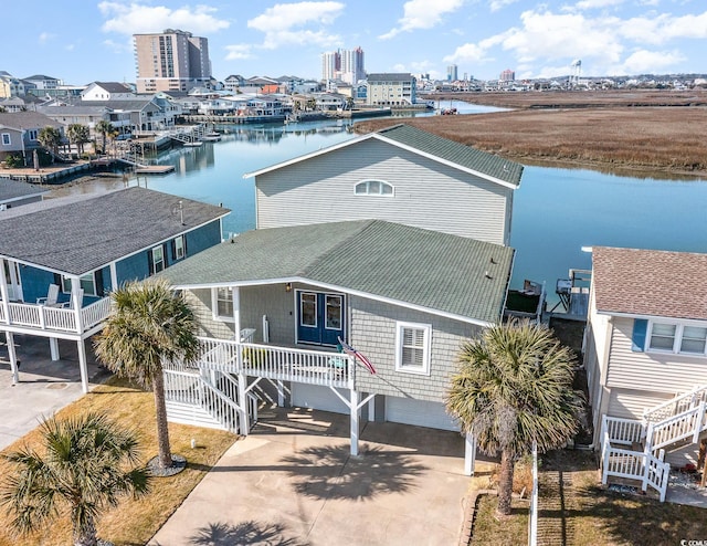 birds eye view of property with a water view