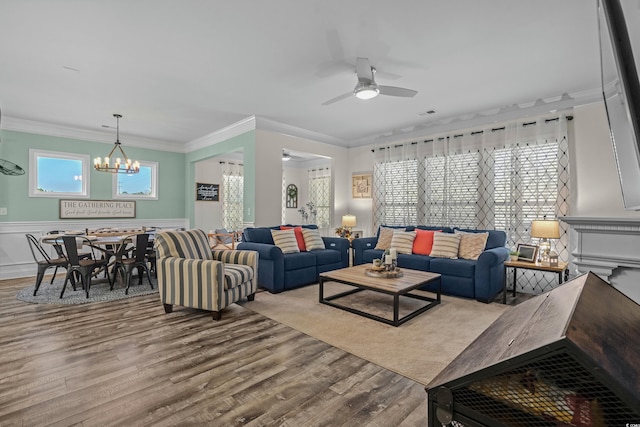 1118 Prescott Cir, Myrtle Beach, SC 29577 - living area with ceiling fan, a chandelier, wood finished floors, crown molding, and a wainscoted wall