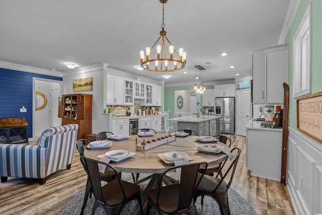 1118 Prescott Cir, Myrtle Beach, SC 29577 - dining room with ornamental molding, beverage cooler, a chandelier, light wood-type flooring, and recessed lighting