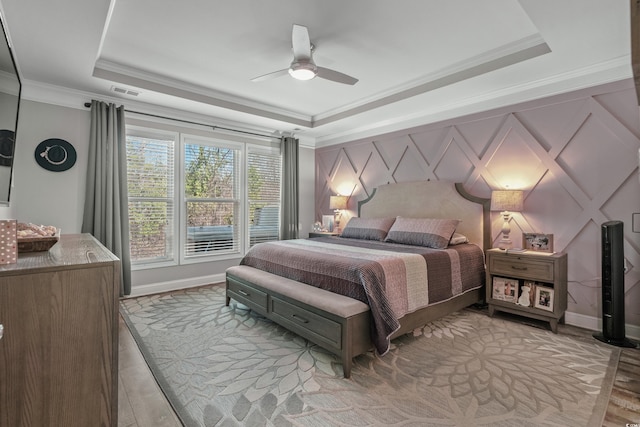 1118 Prescott Cir, Myrtle Beach, SC 29577 - bedroom featuring a raised ceiling, ornamental molding, ceiling fan, and baseboards