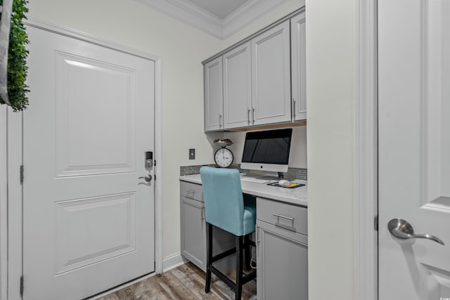 1118 Prescott Cir, Myrtle Beach, SC 29577 - home office with built in desk, crown molding, and light wood-style flooring