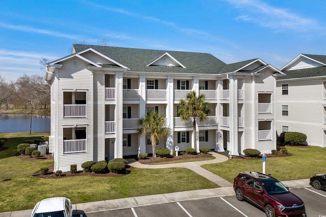 561 White River Dr Unit 11-D, Myrtle Beach, SC 29579 - view of property featuring uncovered parking and a water view