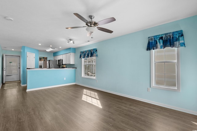 561 White River Dr Unit 11-D, Myrtle Beach, SC 29579 - unfurnished living room featuring a ceiling fan, baseboards, dark wood-style floors, and recessed lighting