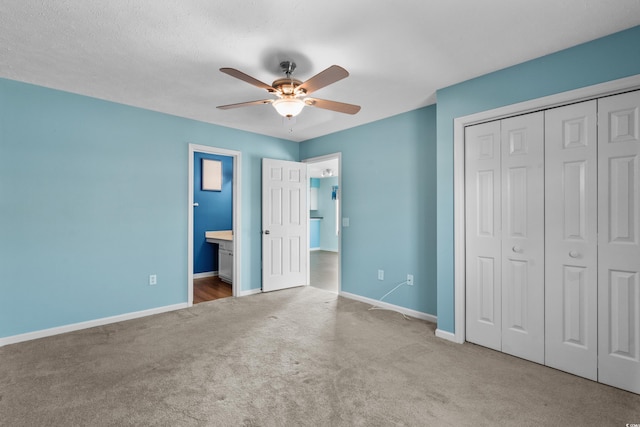 561 White River Dr Unit 11-D, Myrtle Beach, SC 29579 - unfurnished bedroom with carpet, baseboards, a closet, a ceiling fan, and ensuite bath
