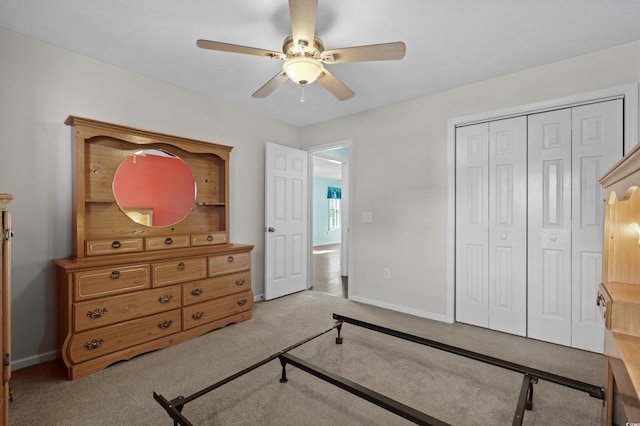 561 White River Dr Unit 11-D, Myrtle Beach, SC 29579 - bedroom featuring light carpet, baseboards, a closet, and a ceiling fan