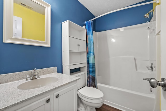 561 White River Dr Unit 11-D, Myrtle Beach, SC 29579 - full bathroom with shower / tub combo with curtain, vanity, toilet, wood finished floors, and a textured ceiling