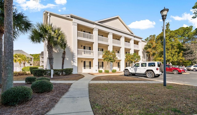 view of property with uncovered parking