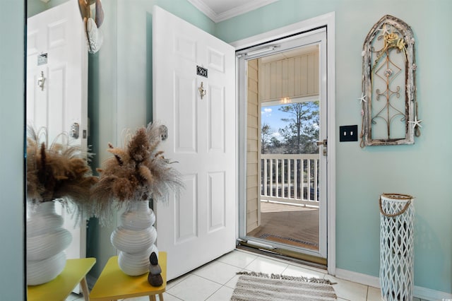 interior space with light tile patterned flooring, crown molding, and baseboards