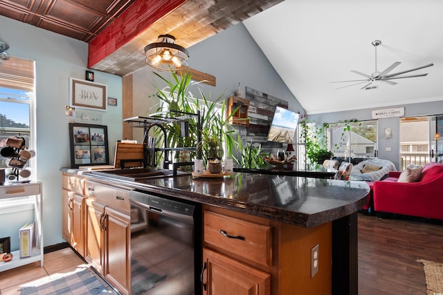 kitchen with ceiling fan with notable chandelier, a sink, wood finished floors, open floor plan, and dishwashing machine