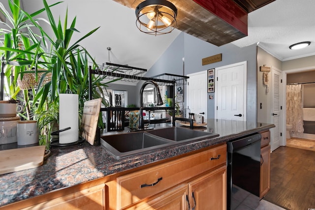 kitchen featuring wood finished floors, brown cabinetry, a sink, dishwasher, and crown molding