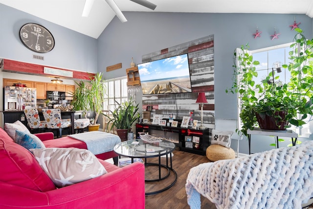 living room with visible vents, high vaulted ceiling, beamed ceiling, and wood finished floors