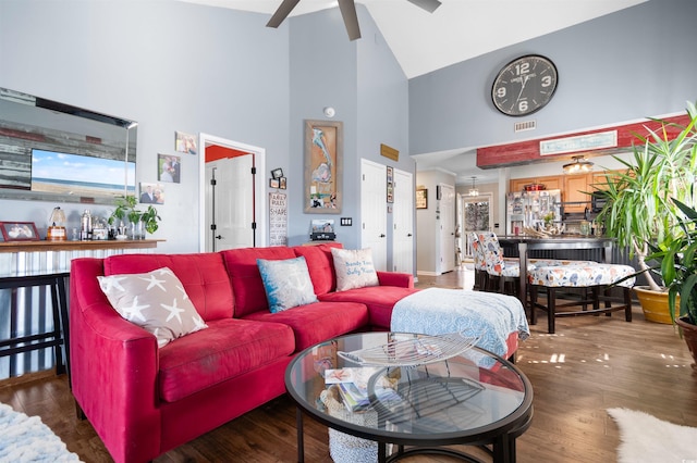 living area featuring visible vents, wood finished floors, high vaulted ceiling, and ceiling fan