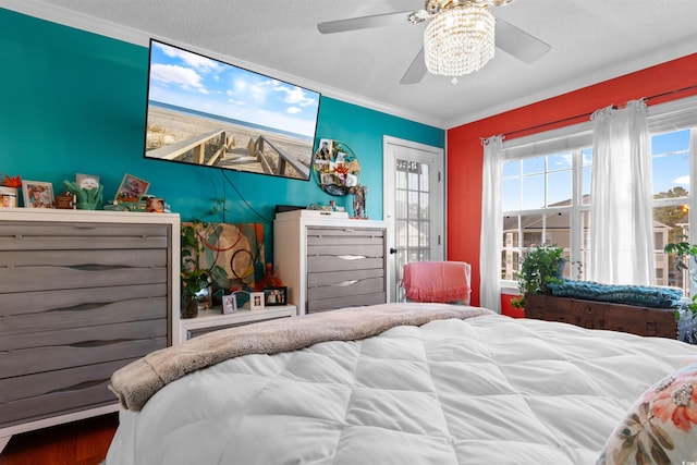 bedroom with ceiling fan and crown molding