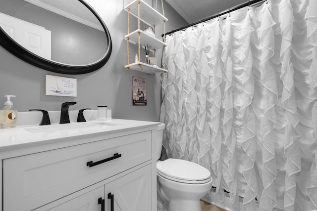 full bathroom with curtained shower, toilet, vanity, and crown molding