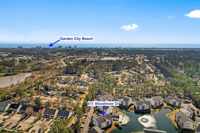 birds eye view of property featuring a water view