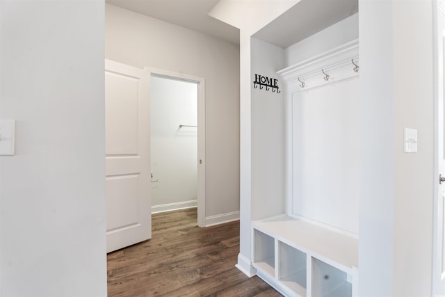 mudroom featuring wood finished floors and baseboards