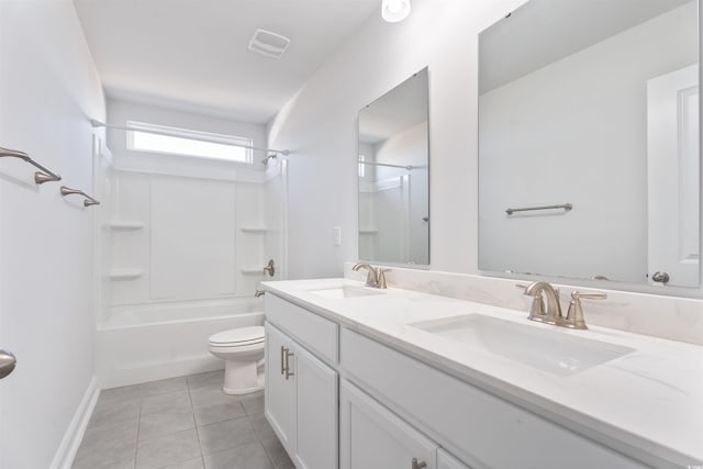 bathroom with toilet, tile patterned flooring, visible vents, and a sink