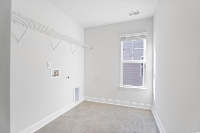 laundry room with laundry area, visible vents, baseboards, washer hookup, and electric dryer hookup