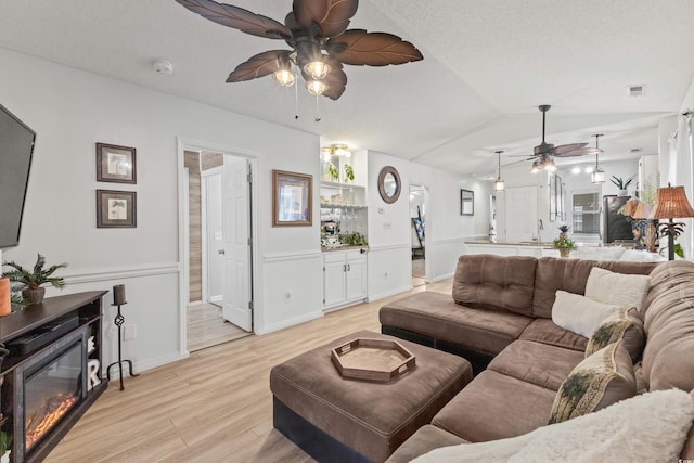 218 Landing Rd Unit G, North Myrtle Beach, SC 29582 - living room featuring ceiling fan, light wood finished floors, and vaulted ceiling