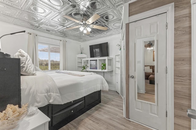 218 Landing Rd Unit G, North Myrtle Beach, SC 29582 - bedroom with an ornate ceiling and light wood finished floors