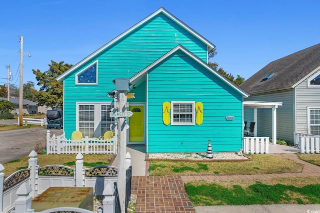 view of front of house with fence