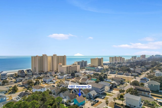 birds eye view of property featuring a water view and a city view