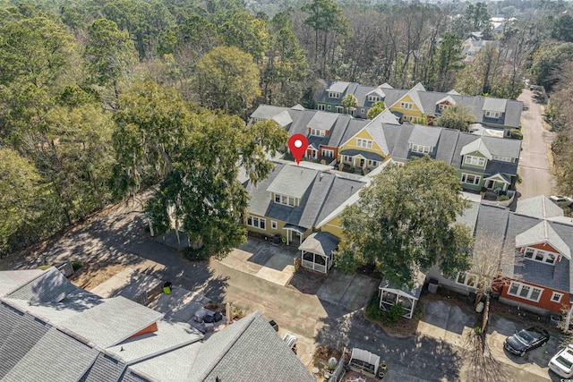 birds eye view of property with a forest view and a residential view