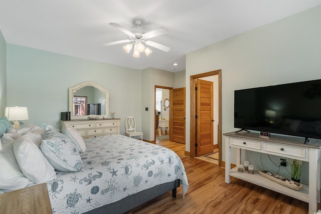 bedroom with wood finished floors and a ceiling fan