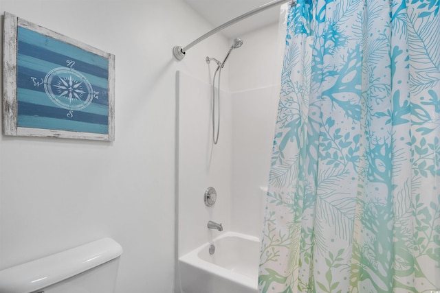 bathroom featuring bathing tub / shower combination and toilet