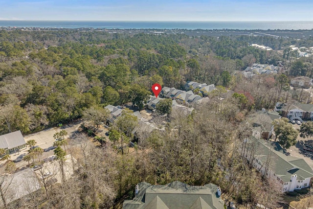 birds eye view of property with a wooded view