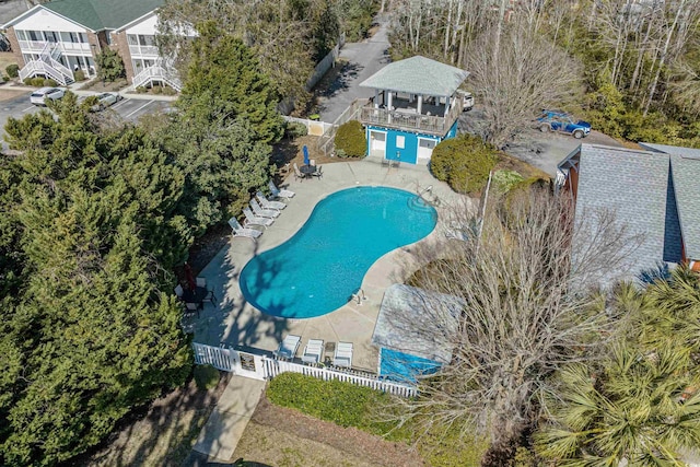 pool featuring a patio area and fence