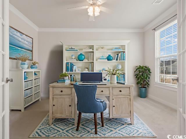 office space featuring ornamental molding, a ceiling fan, and light colored carpet