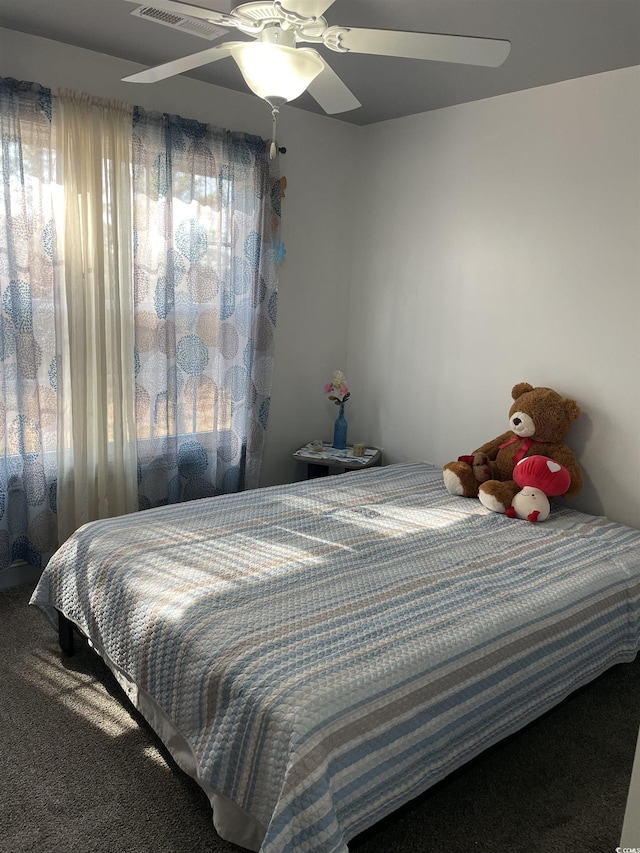 carpeted bedroom featuring ceiling fan