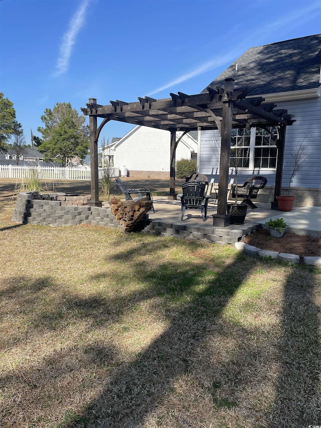 view of yard featuring a patio, fence, and a pergola