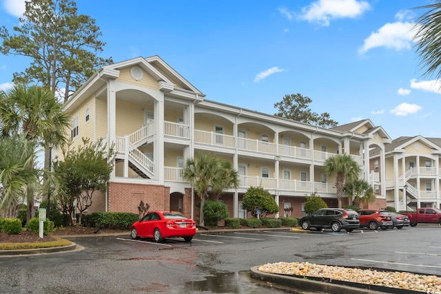 view of property with uncovered parking