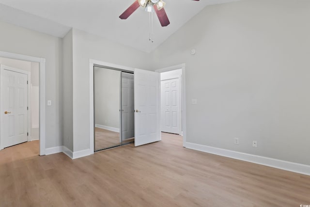 unfurnished bedroom with light wood finished floors, a closet, and baseboards