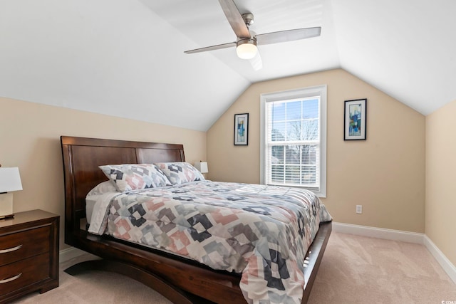 bedroom with light carpet, ceiling fan, lofted ceiling, and baseboards