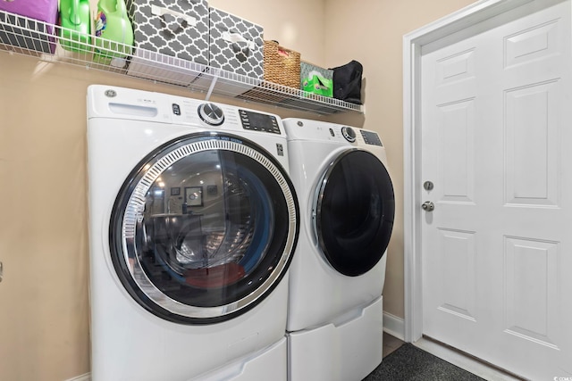 laundry area featuring laundry area and washer and clothes dryer