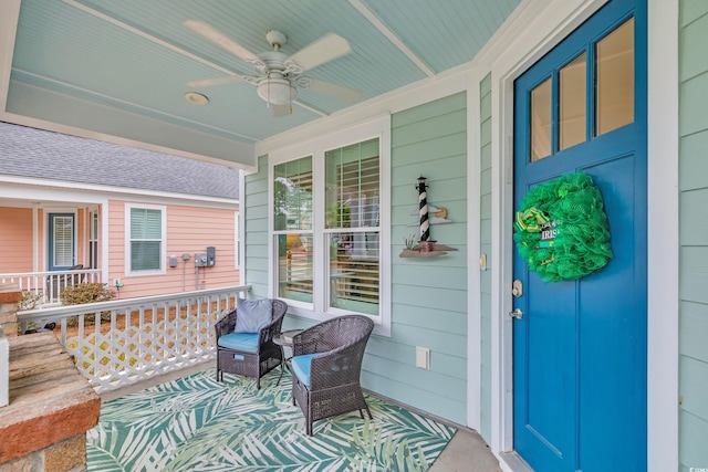 deck featuring a porch and a ceiling fan