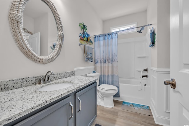 full bathroom featuring shower / tub combo, toilet, wood finished floors, and vanity