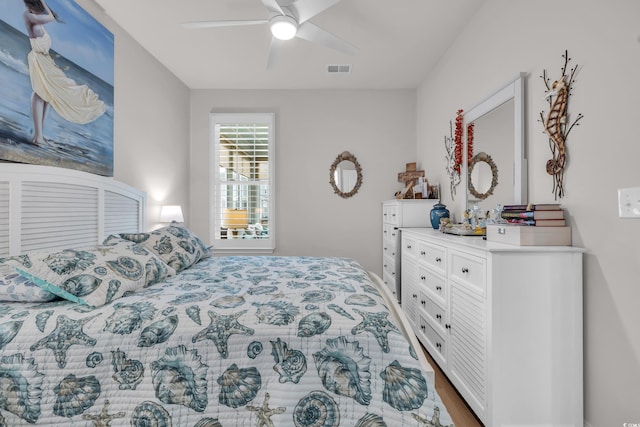 bedroom featuring visible vents and ceiling fan