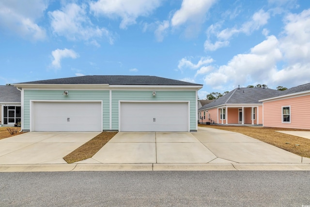 view of front of property featuring an attached garage and driveway