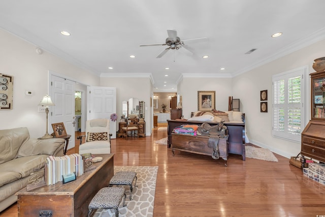 bedroom with ornamental molding, light wood-type flooring, recessed lighting, and baseboards