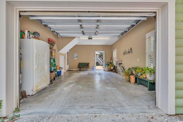 garage with freestanding refrigerator