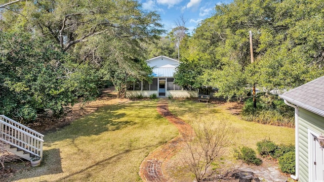 view of yard with a sunroom